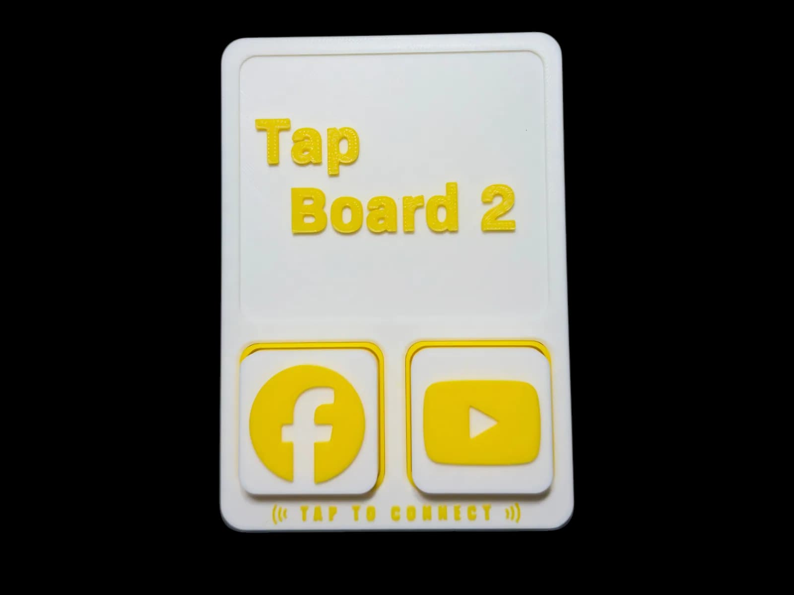 Tap Board 2 flat on the counter with two tiles in place: Facebook and YouTube.